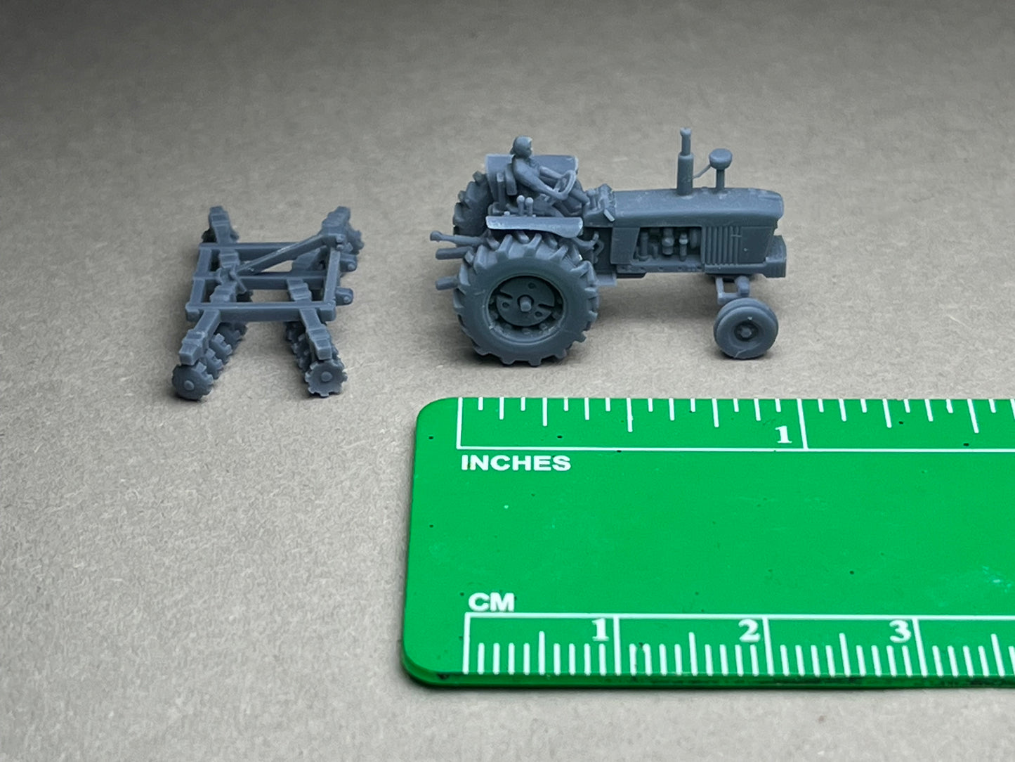UNPAINTED N Scale (1:160 or 12mm) One (1) Model 4020 Female driver w harrow - NOT A TOY